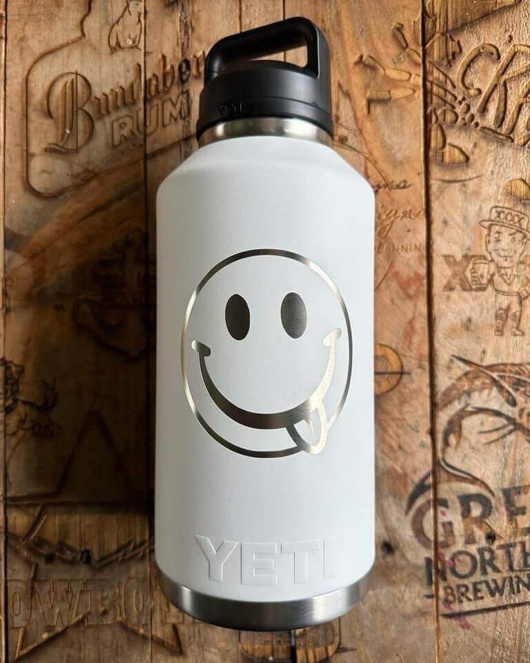 Ultimate Guide to Laser Engraving Your Yeti Drinkware - Custom engraved YETI bottle with smiley face design.