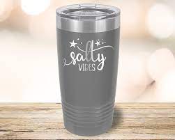Unique Custom Laser Etching for Your Yeti Drinkware featuring a grey tumbler with 'Salty Vibes' engraving.