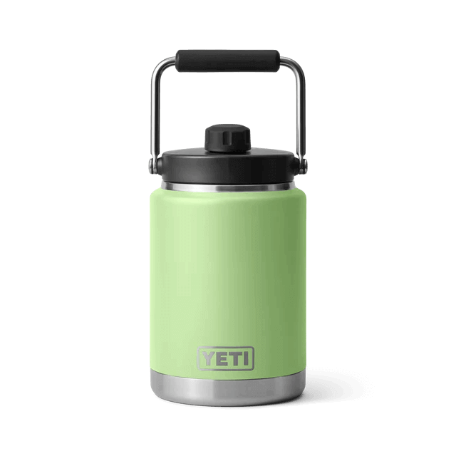 A slender white YETI bottle with a built-in handle, perfect for outdoor adventures.