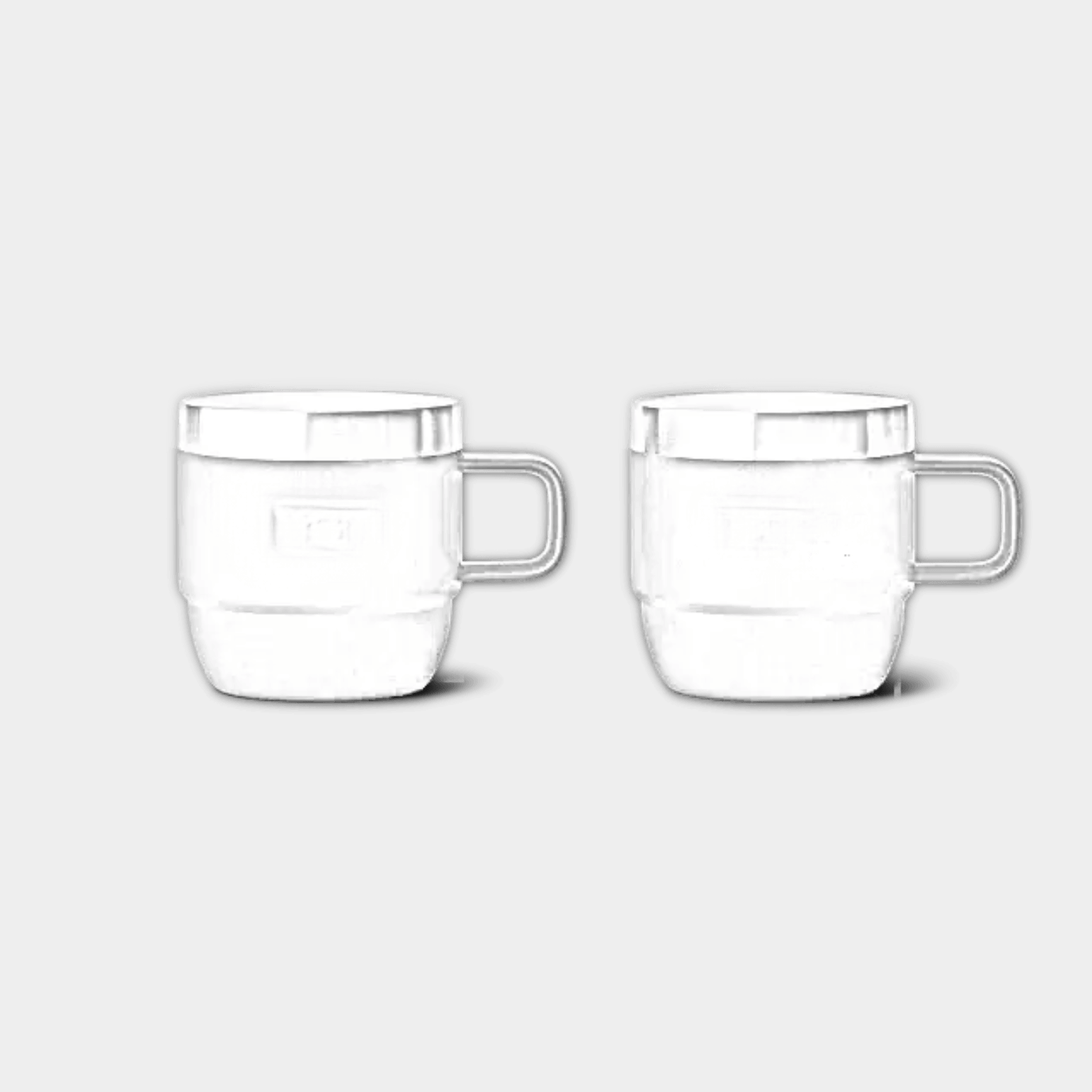 Two customizable YETI Rambler stackable mugs with Durasip ceramic lining, featuring laser-etched ETCH branding and 6 oz capacity.