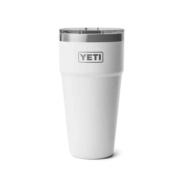 White YETI tumbler with a stainless steel rim, designed to keep drinks at the perfect temperature.