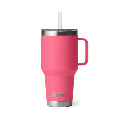 Customizable YETI Rambler 35 oz Straw Mug in vibrant pink color featuring a stainless steel straw and a comfortable handle.